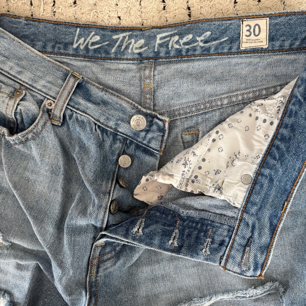 We The Free Light Wash Distressed High-Rise Denim Shorts with Floral Pocket